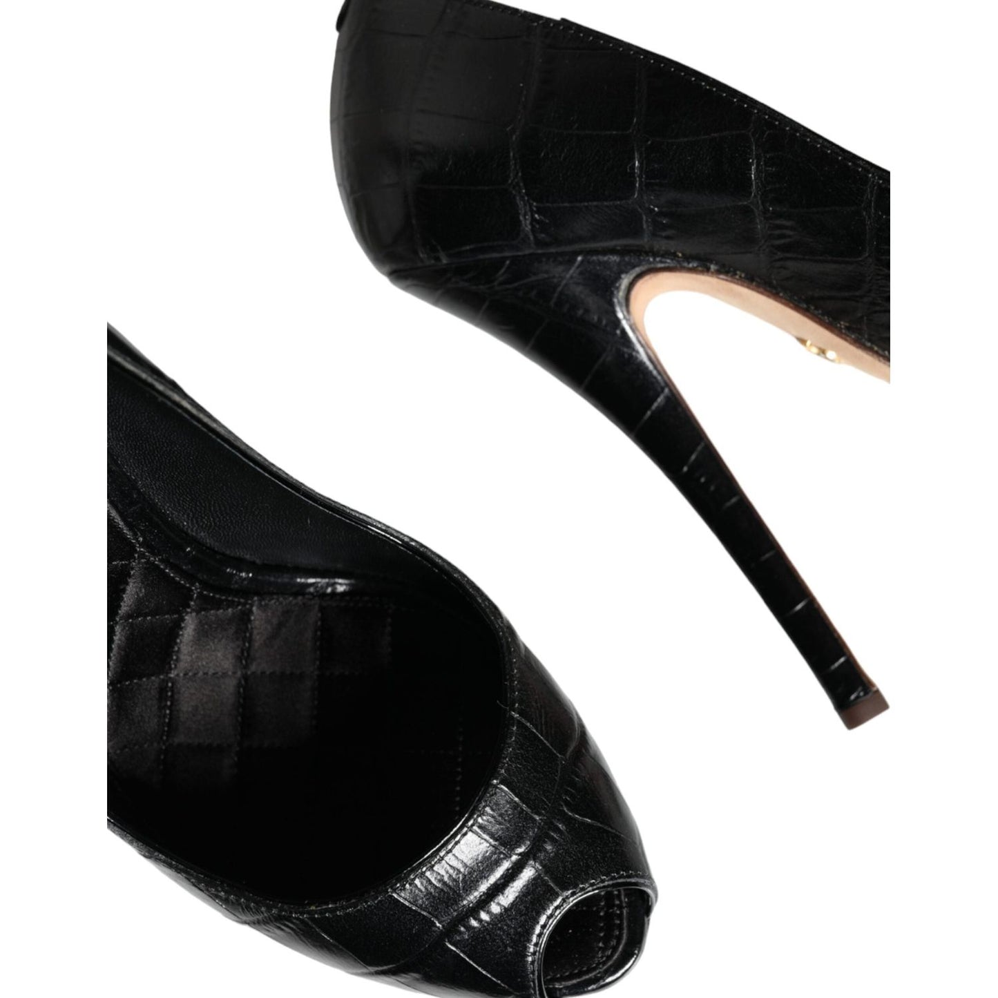 Dolce & Gabbana black leather platform heels pumps with logo details, sleek design, luxurious craftsmanship, made in Italy.