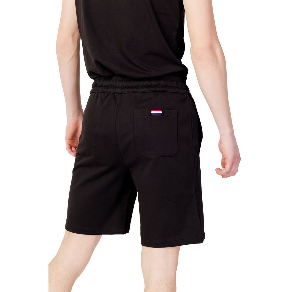 Back view of men's black cotton Bermuda shorts from U.S. Polo Assn. Spring/Summer Collection, featuring elastic waistband and single back pocket.