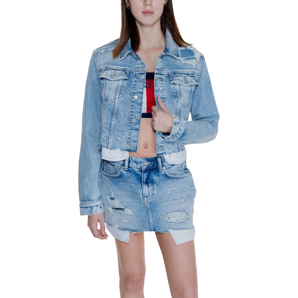 Woman wearing Tommy Hilfiger light blue recycled cotton jacket with denim skirt, front view.