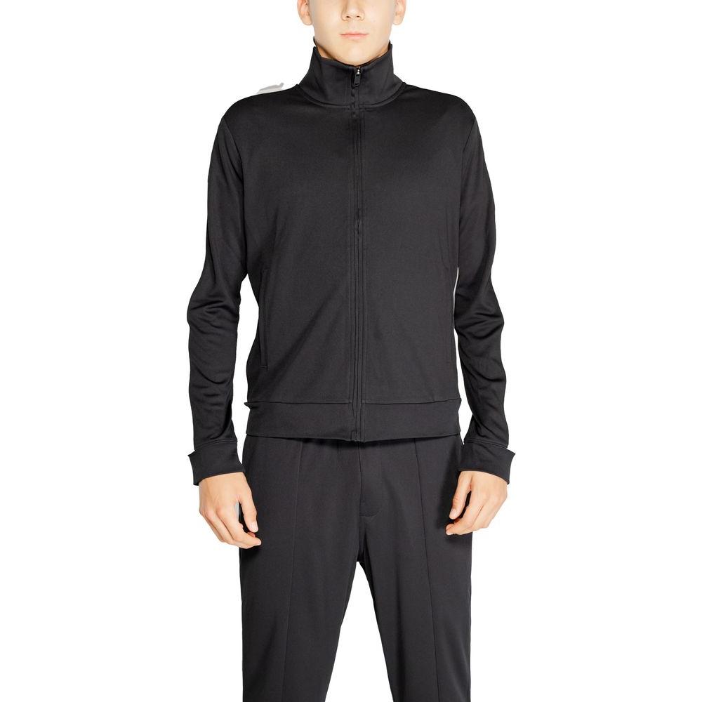 Man wearing Calvin Klein Sport black recycled polyester full zip hoodie, showcasing modern fit and sustainable design.