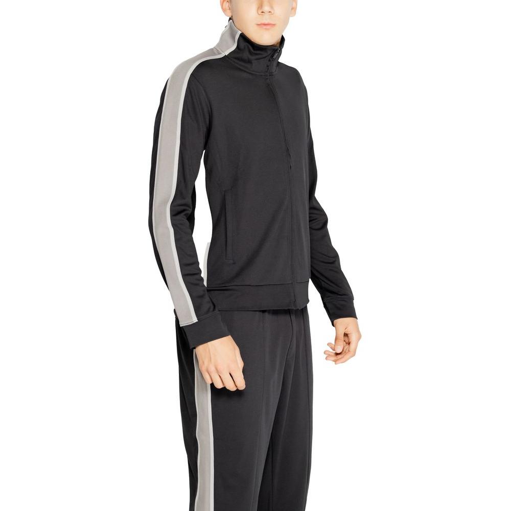 Calvin Klein Sport Black Full Zip Hoodie for Men in Recycled Polyester, with Side Stripes, Model Facing Left