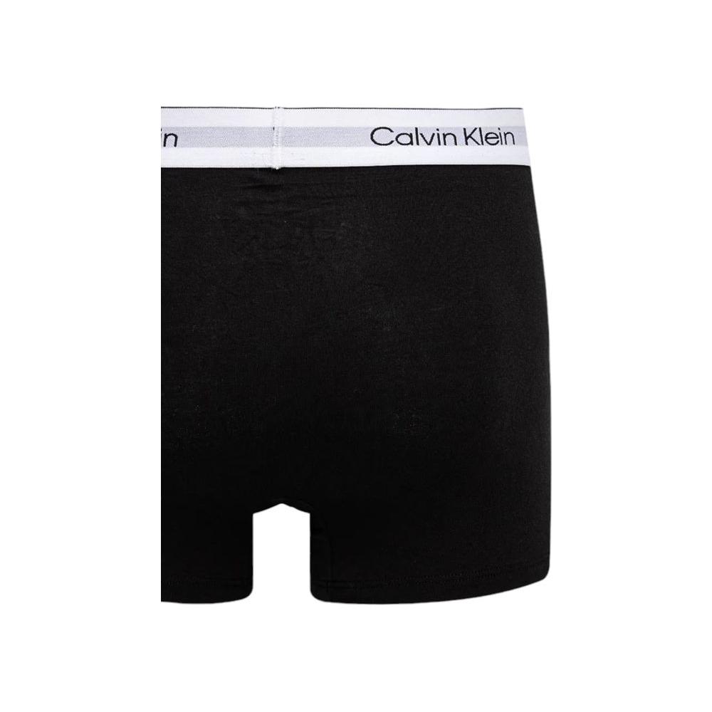 Calvin Klein black cotton boxers with logo waistband, featuring a sleek design made from 95% cotton and 5% elastane for comfort.