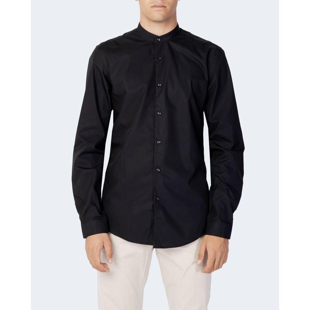 Antony Morato black slim fit cotton shirt with button closure, worn by model standing, ideal for formal and casual occasions.