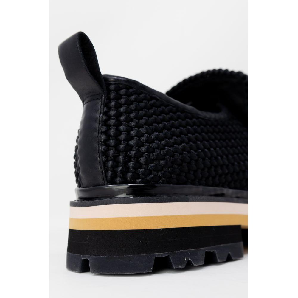 Close-up of ASH black leather flat shoe for women, featuring woven texture, perfect for spring/summer fashion collection.