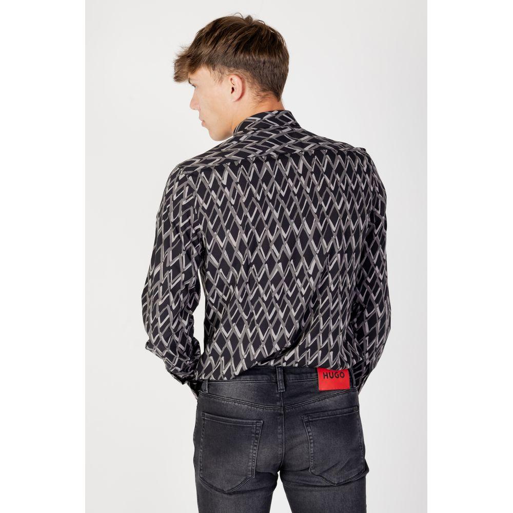 Man wearing a patterned long-sleeve shirt with black jeans, viewed from the back.