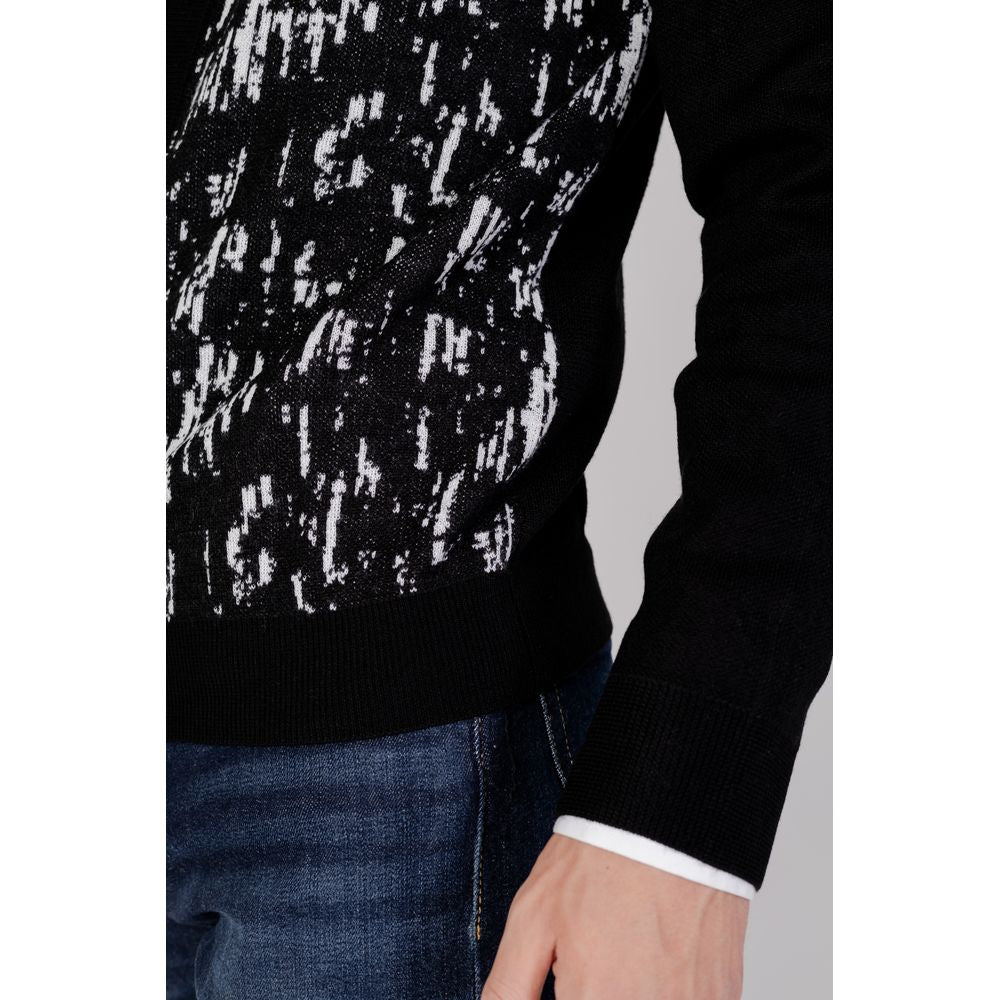 Model wearing Antony Morato black wool cardigan, part of men's fall/winter knitwear collection, made of 50% wool and 50% acrylic.
