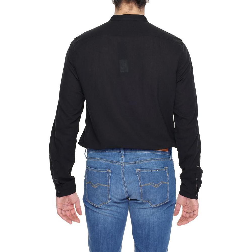Back view of Antony Morato men's long sleeve black cotton shirt, part of the Spring/Summer collection, paired with blue jeans.