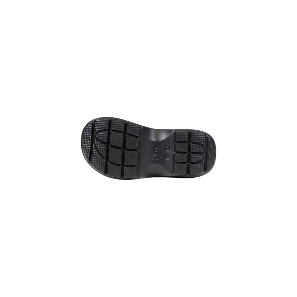 Underside view of Crocs Black Croslite Boot showing the tread pattern and grip design for enhanced traction.