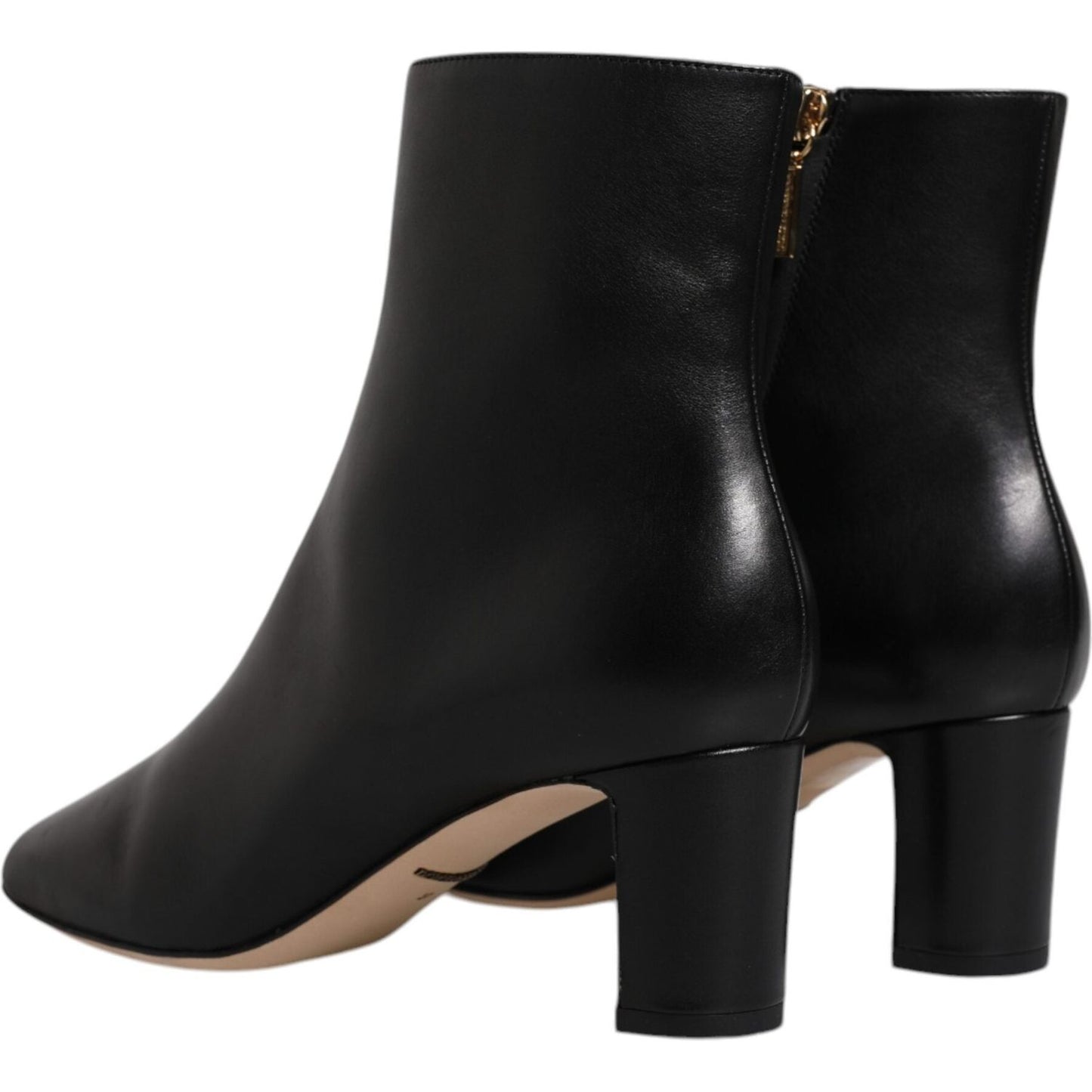 Dolce & Gabbana black leather mid calf boots with side zipper closure and logo details. High craftsmanship and made in Italy.