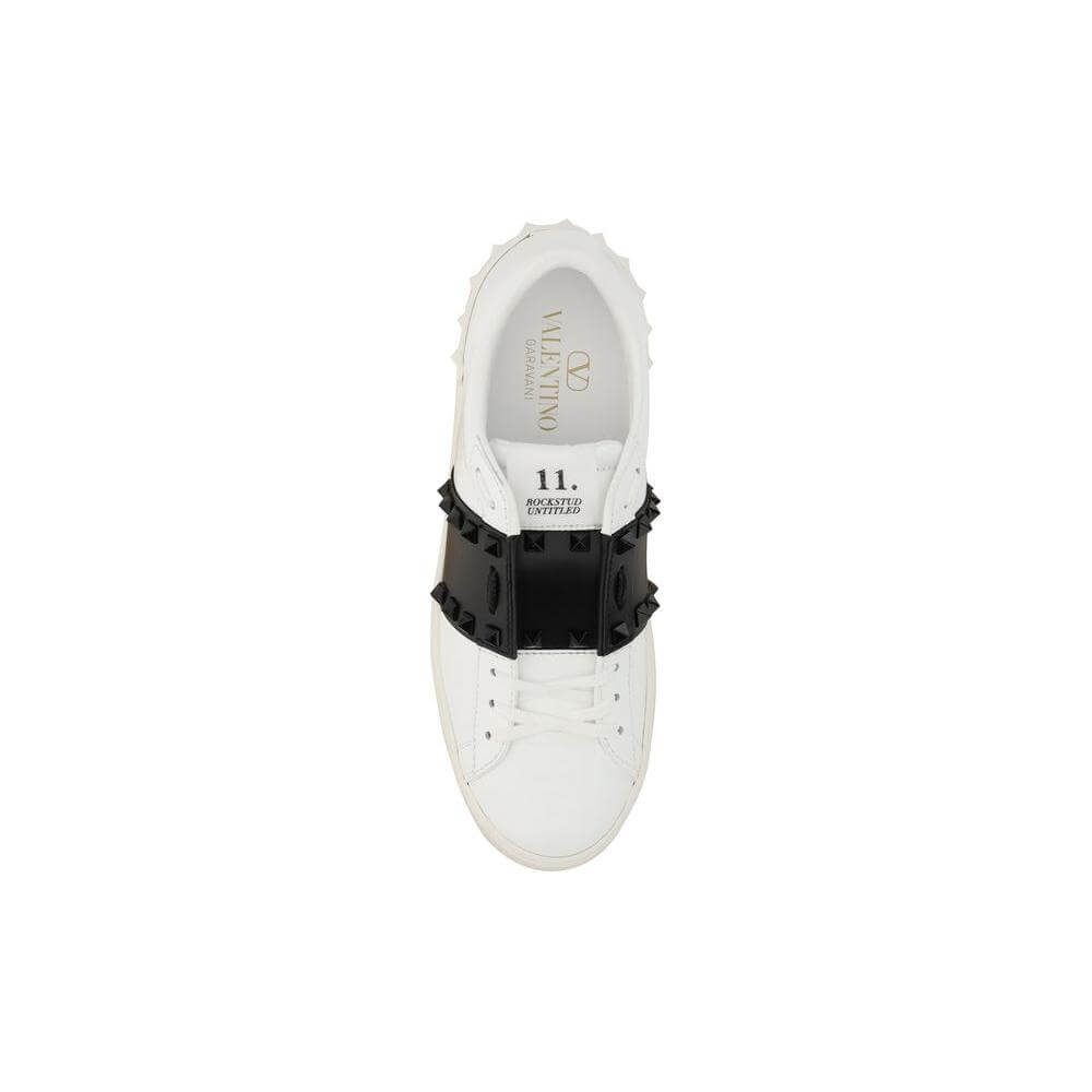 Valentino Garavani Rockstud Open sneaker, top view, showing white leather with black band and contrasting logo, round toe design.
