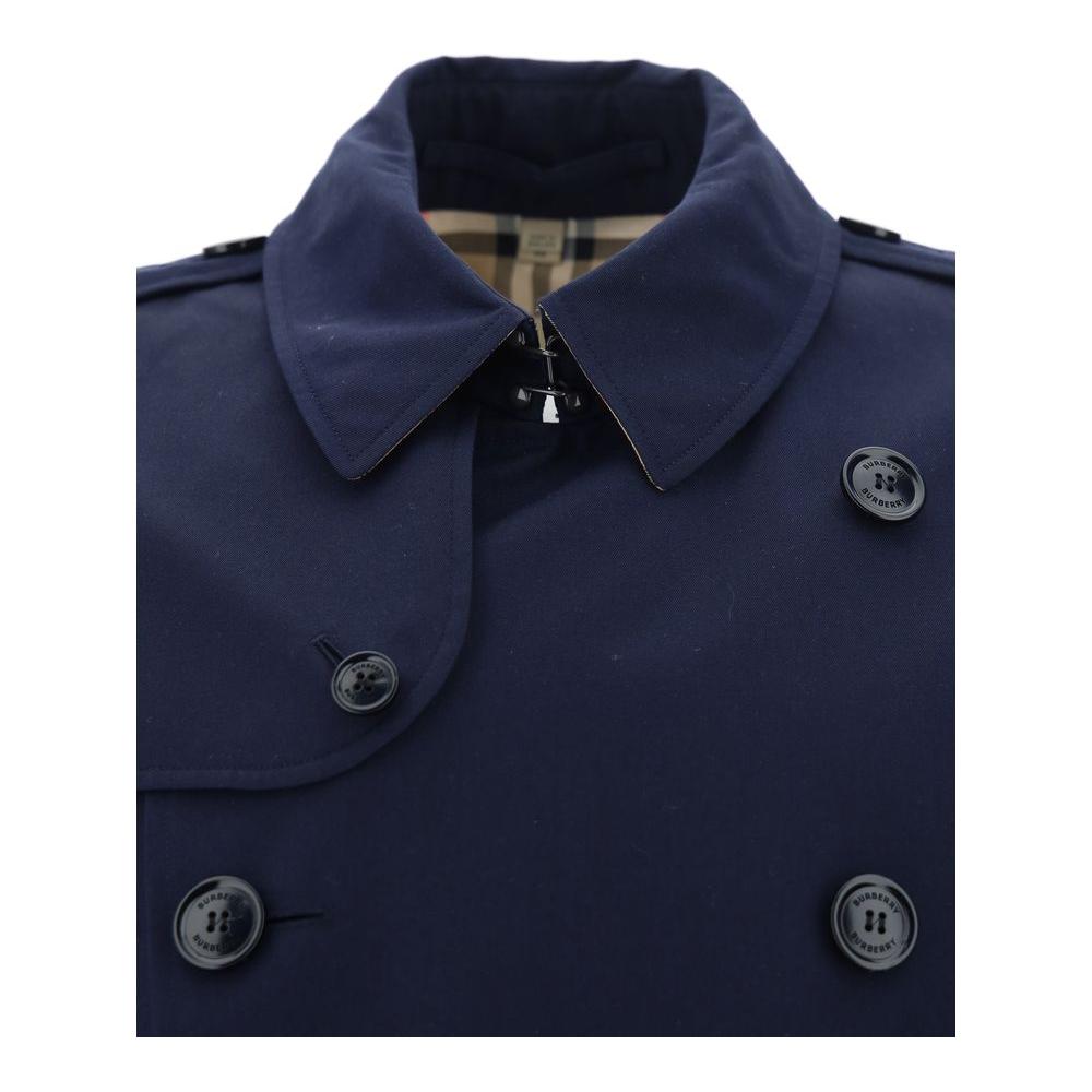 Close-up of Burberry Kensington Coat in navy, featuring classic collar and double-breasted button detail.