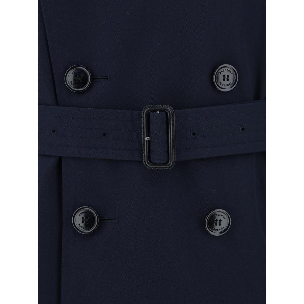 Close-up of Burberry Kensington Coat featuring double-breasted button closure and adjustable waistband belt in monochrome fabric.