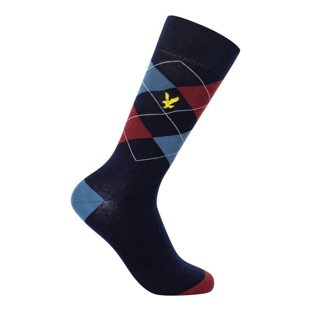 Argyle patterned sock with navy, red, and blue design, featuring a yellow logo emblem.