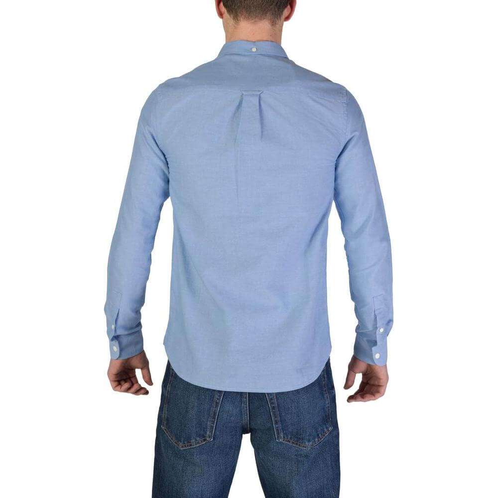Back view of man wearing Lyle & Scott blue long sleeve organic cotton shirt, part of fall/winter collection.