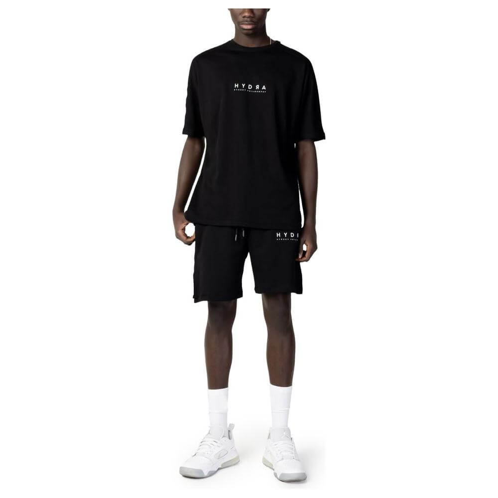 Alt Tag: Front view of a men's black cotton sweatsuit by Hydra Clothing, featuring short sleeves and shorts from the spring/summer collection.