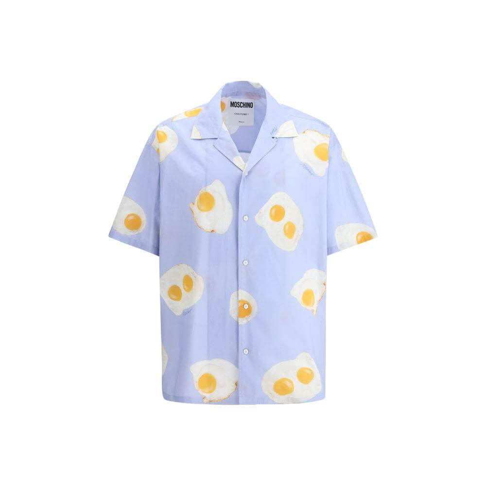 Moschino printed short sleeve shirt with egg graphic, button closure, and classic lapels, offering a fun, stylish look.