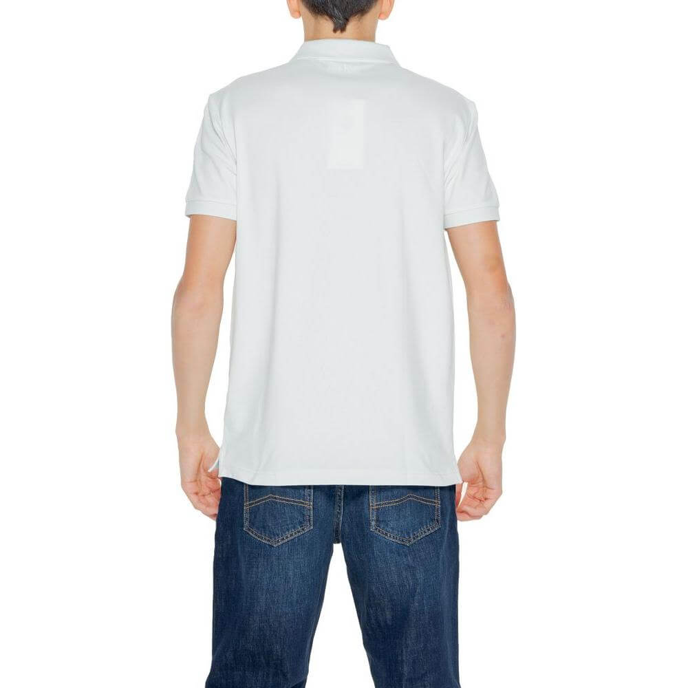 Man wearing Calvin Klein green cotton polo shirt from spring/summer collection, short sleeves, back view, paired with jeans.