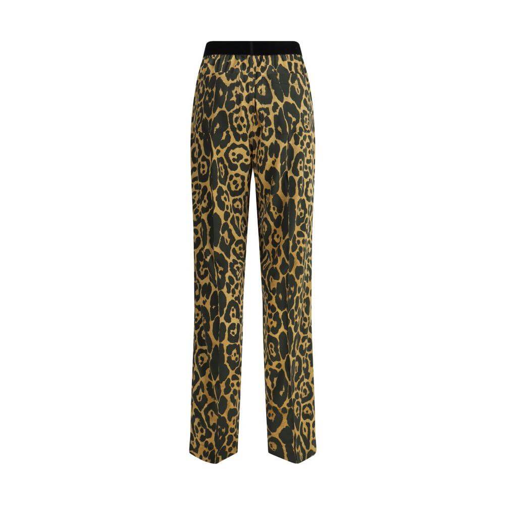 Tom Ford silk pants with animal print, featuring a contrasting elastic waistband and multiple pockets for style and functionality.