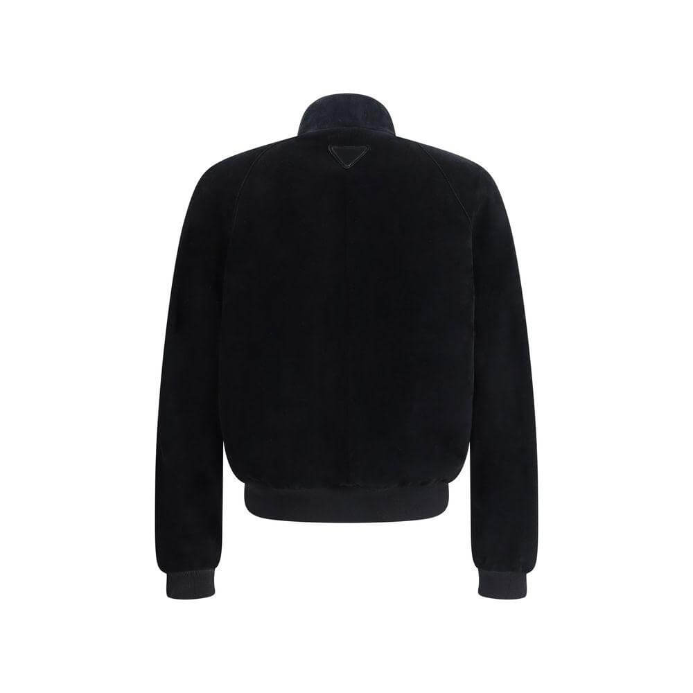 Back view of Prada suede bomber jacket with high collar, ribbed hem, cuffs, and triangular brand patch.