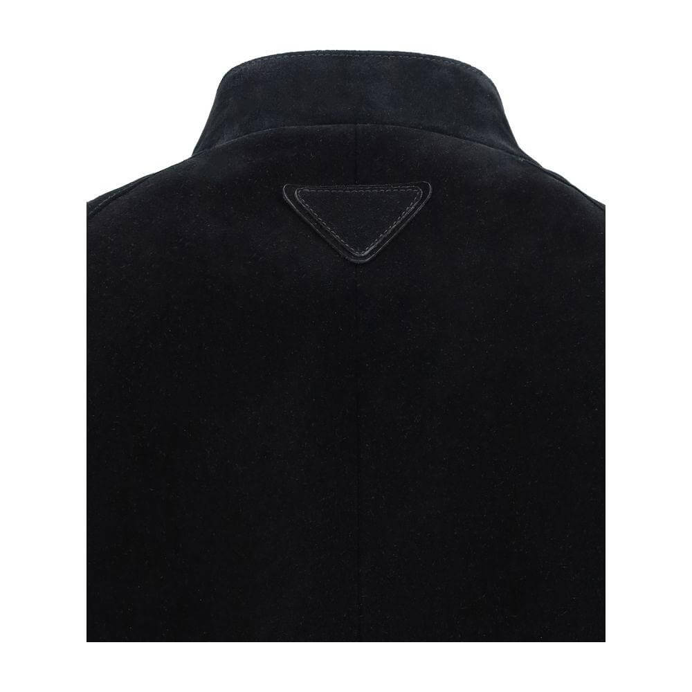 Back view of Prada suede bomber jacket with triangular brand patch and high collar.