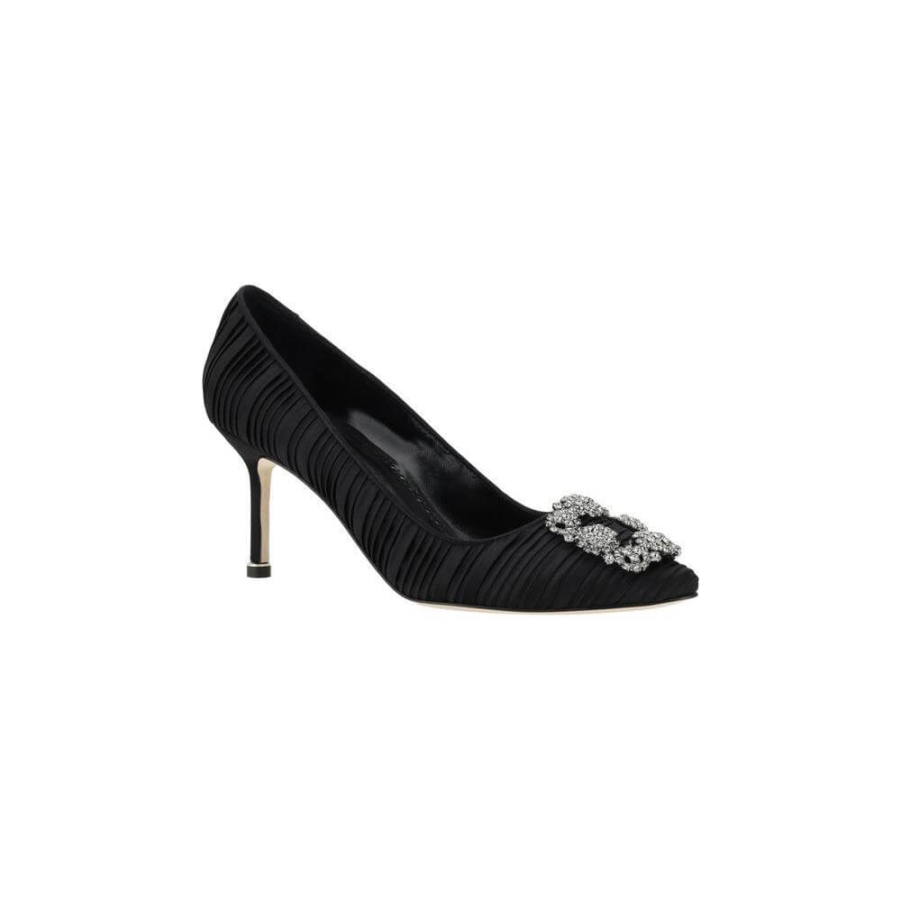 Manolo Blahnik Hangisi Pumps in black silk satin with Swarovski crystal buckle and leather stiletto heel for timeless elegance.