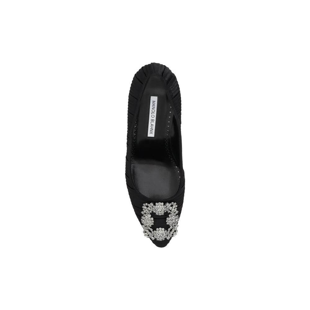 Top view of black Manolo Blahnik Hangisi Pump with crystal buckle, showcasing luxury and elegance in silk satin.