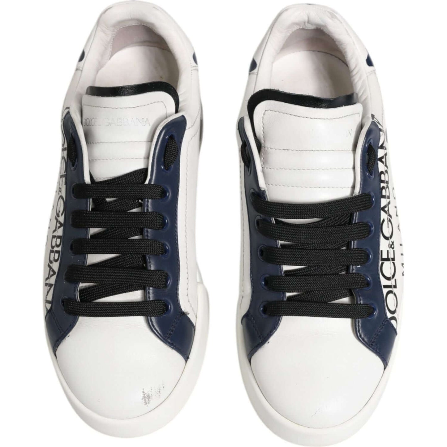 Dolce & Gabbana white blue leather sneakers with crown, logo detail, and lace-up design. Low-top, pre-owned with minor wear.
