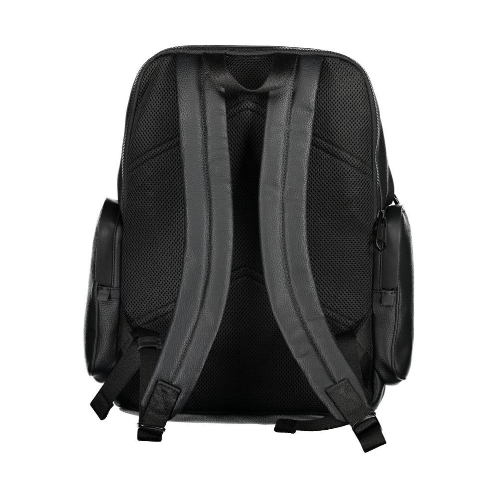 Back view of Calvin Klein black polyester backpack with adjustable straps and side pockets.