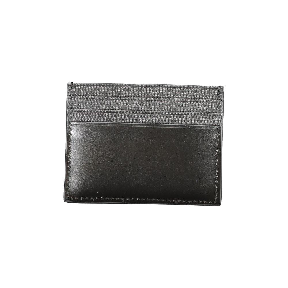 Calvin Klein black leather wallet with central card holder, contrast details, and logo design.