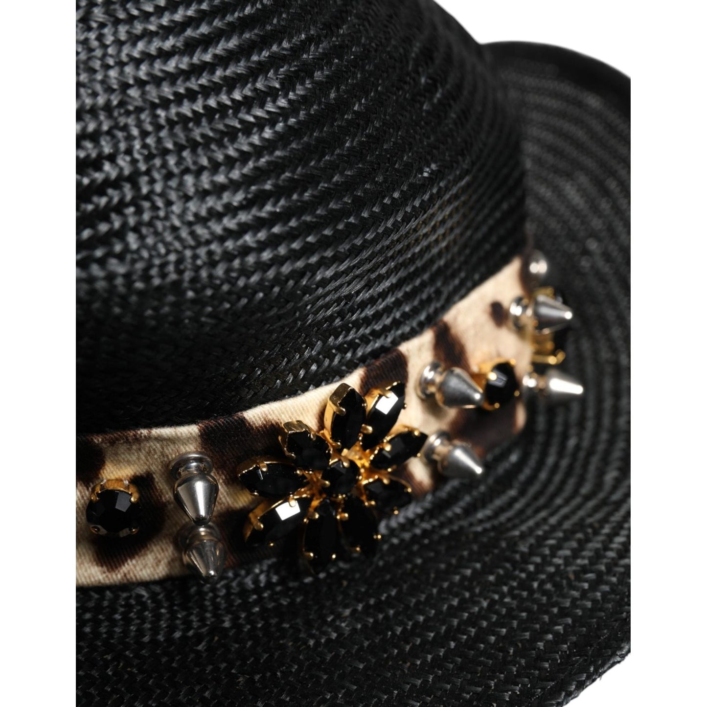 Dolce & Gabbana black straw wide brim hat with crystal embellishments and studs, close-up view.