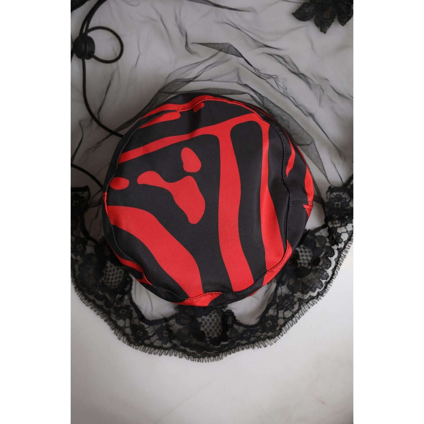 Dolce & Gabbana black and red striped lace tulle bucket hat, 100% polyester, women's fashion accessory, made in Italy.