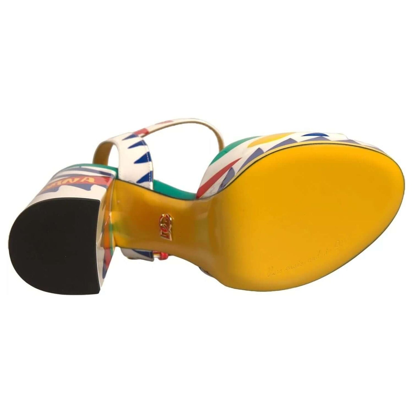 Bottom view of Dolce & Gabbana Multicolor Carretto ankle strap heels showcasing yellow leather sole and buckle closure.