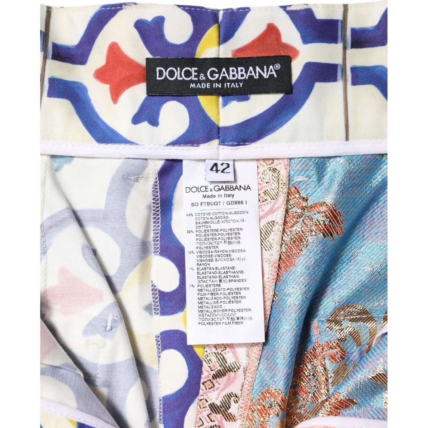 Dolce & Gabbana label and multicolor Majolica fabric on women's high waist hot pants shorts, showcasing luxury design and craftsmanship.