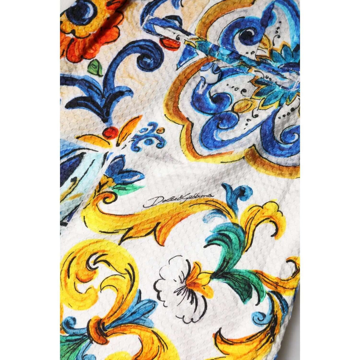 Dolce & Gabbana multicolor majolica print detail on high waist shorts with vibrant floral patterns and logo.
