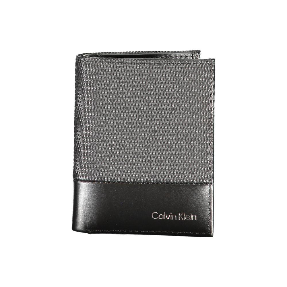 Calvin Klein black leather wallet with RFID blocking, coin purse, card spaces, contrast details, and logo.