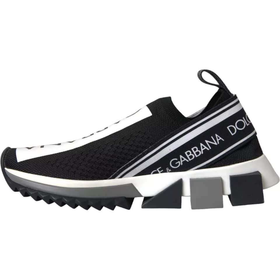 Dolce & Gabbana black and white Sorrento slip-on sneakers with logo print and decorative rubber sole.