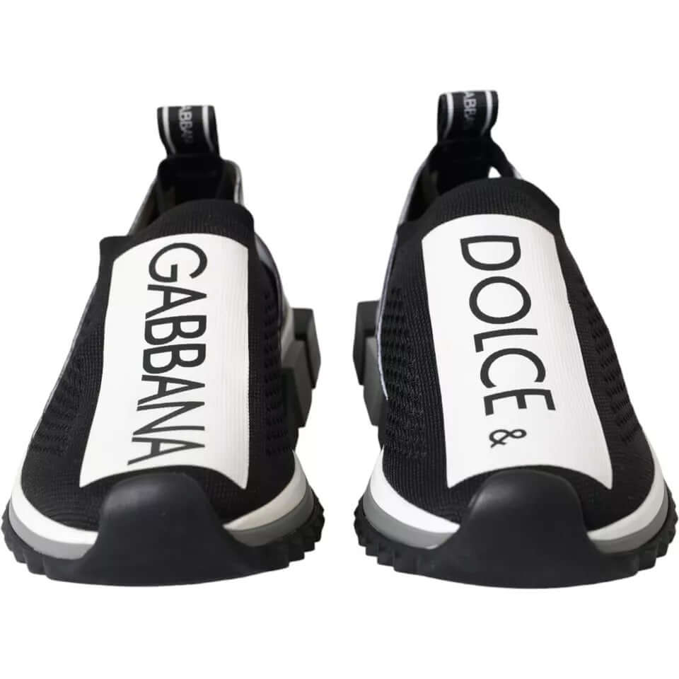 Dolce & Gabbana black and white Sorrento slip-on sneakers with logo print, rubber sole, and pull strap.
