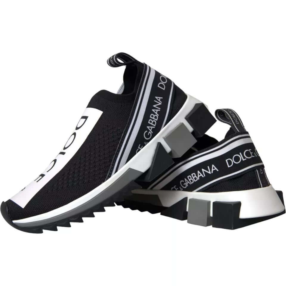 Dolce & Gabbana black and white Sorrento slip-on sneakers with logo print and rubber sole.