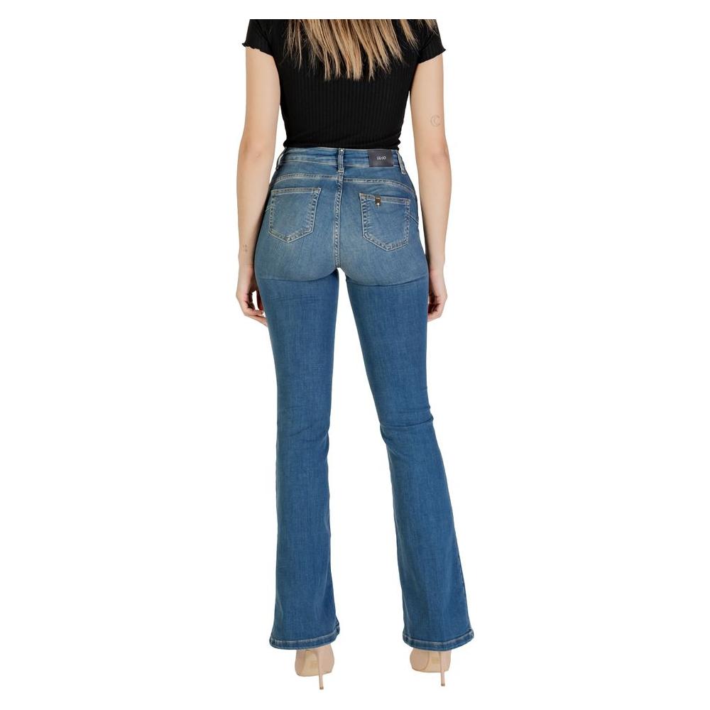 Back view of woman wearing Liu Jo blue flared cotton jeans with high waist, showcasing bootcut silhouette and comfortable fit.