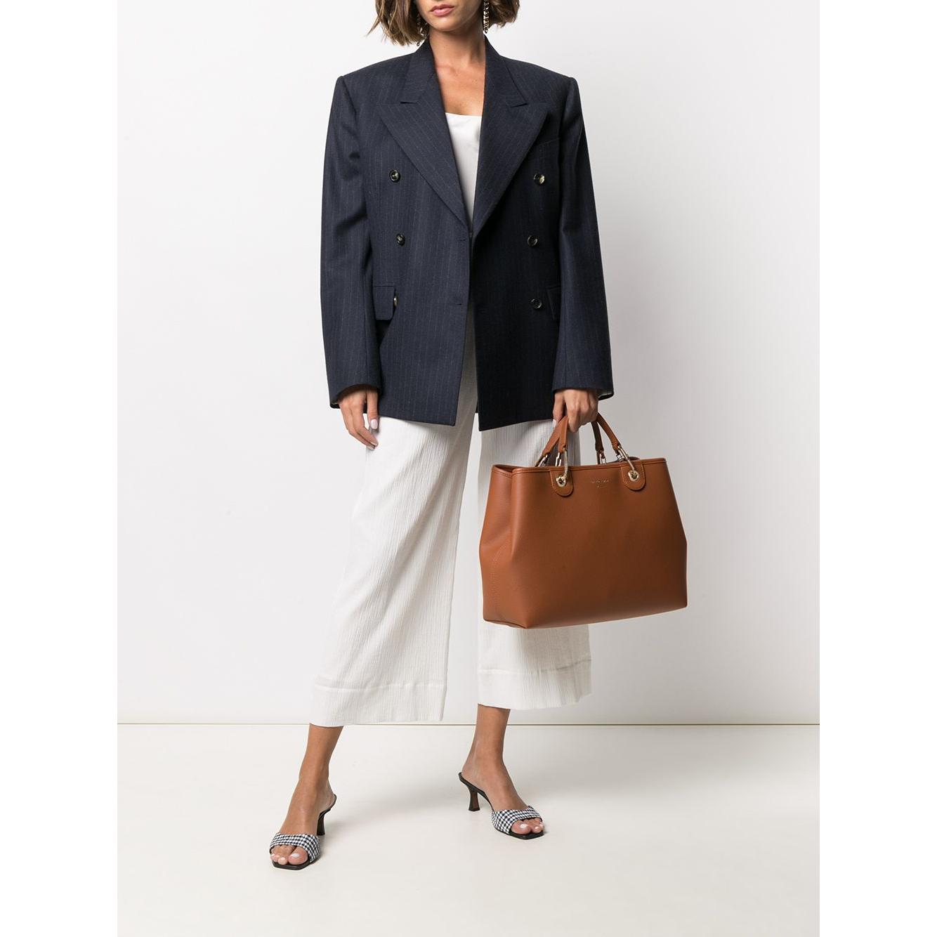 Front view with bag zipped and handles upright.