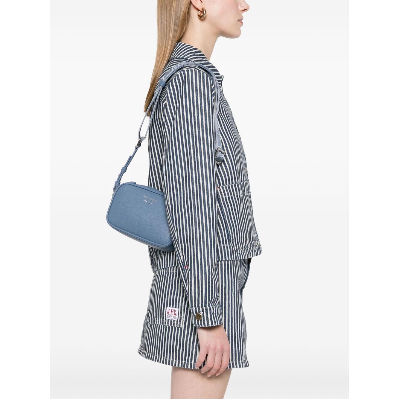 Front view with bag zipped and handles upright.