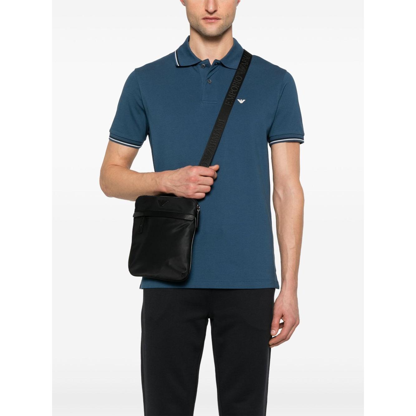 Front view with bag zipped and handles upright.