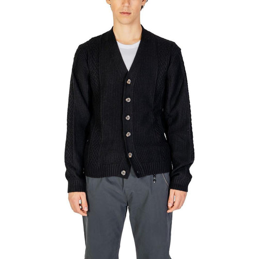 Man wearing Hamaki-Ho black polyester cardigan, fall/winter men's knitwear, button-up, blend of polyester, acrylic, nylon, wool.