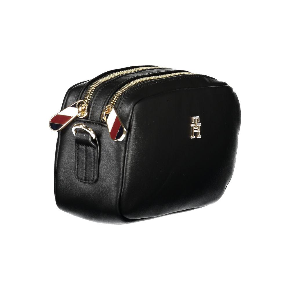 Front view with bag zipped and handles upright.