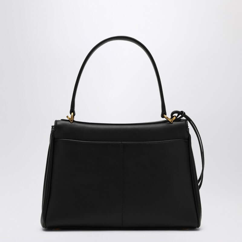 Front view with bag zipped and handles upright.